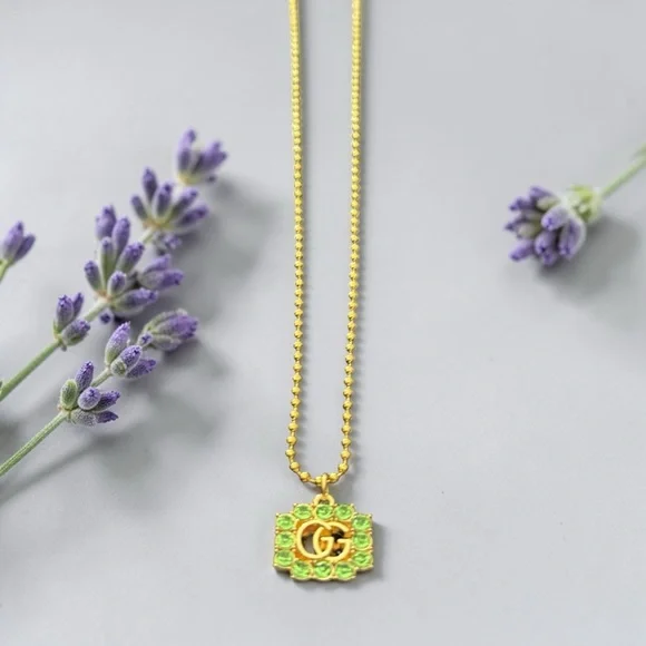 Gucci Gold-Tone up cycled GG Pendant Necklace with Green Crystals - Picture 2 of 5